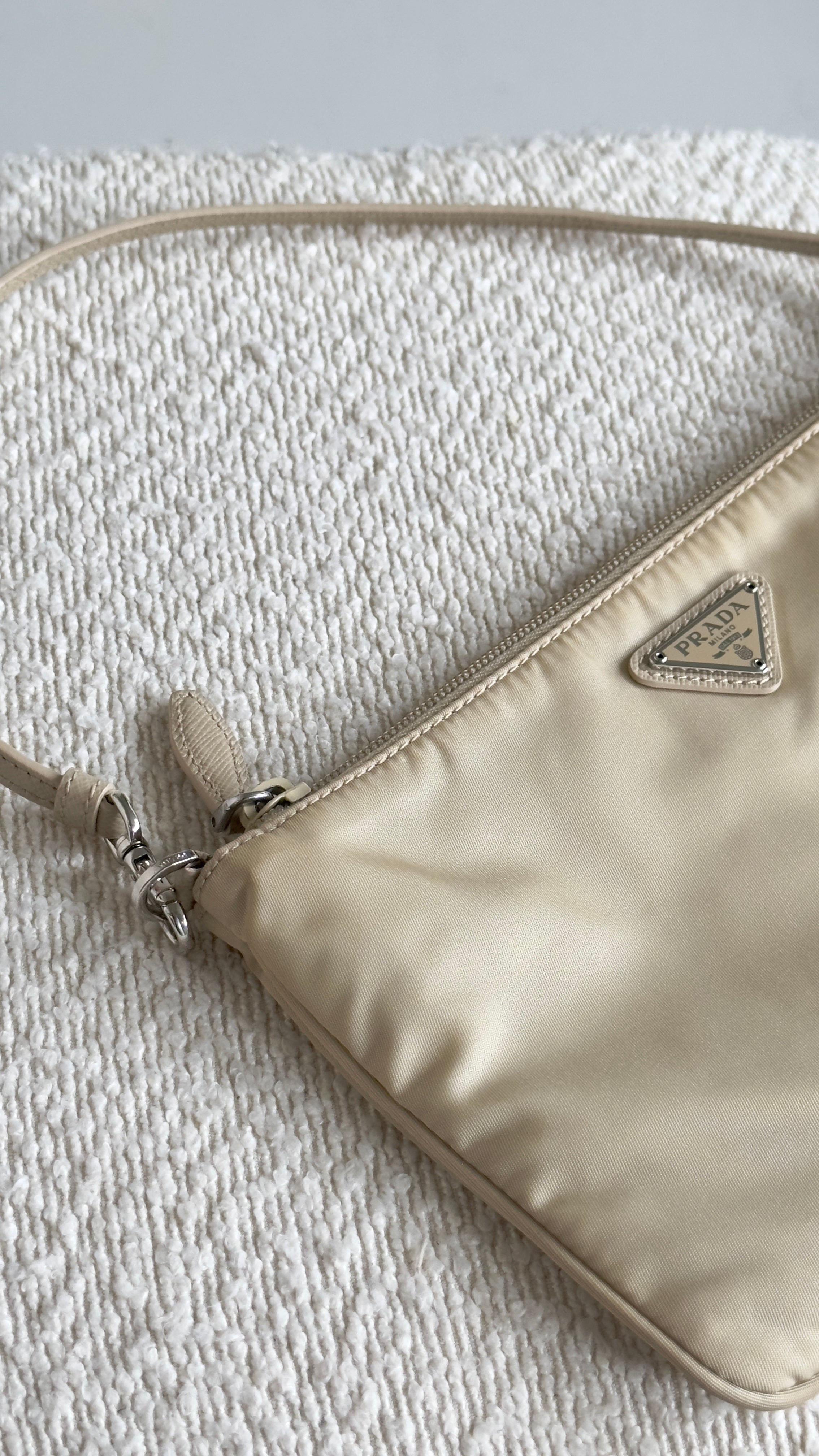 PRADA RE-NYLON TOP HANDLE BAG IN BEIGE