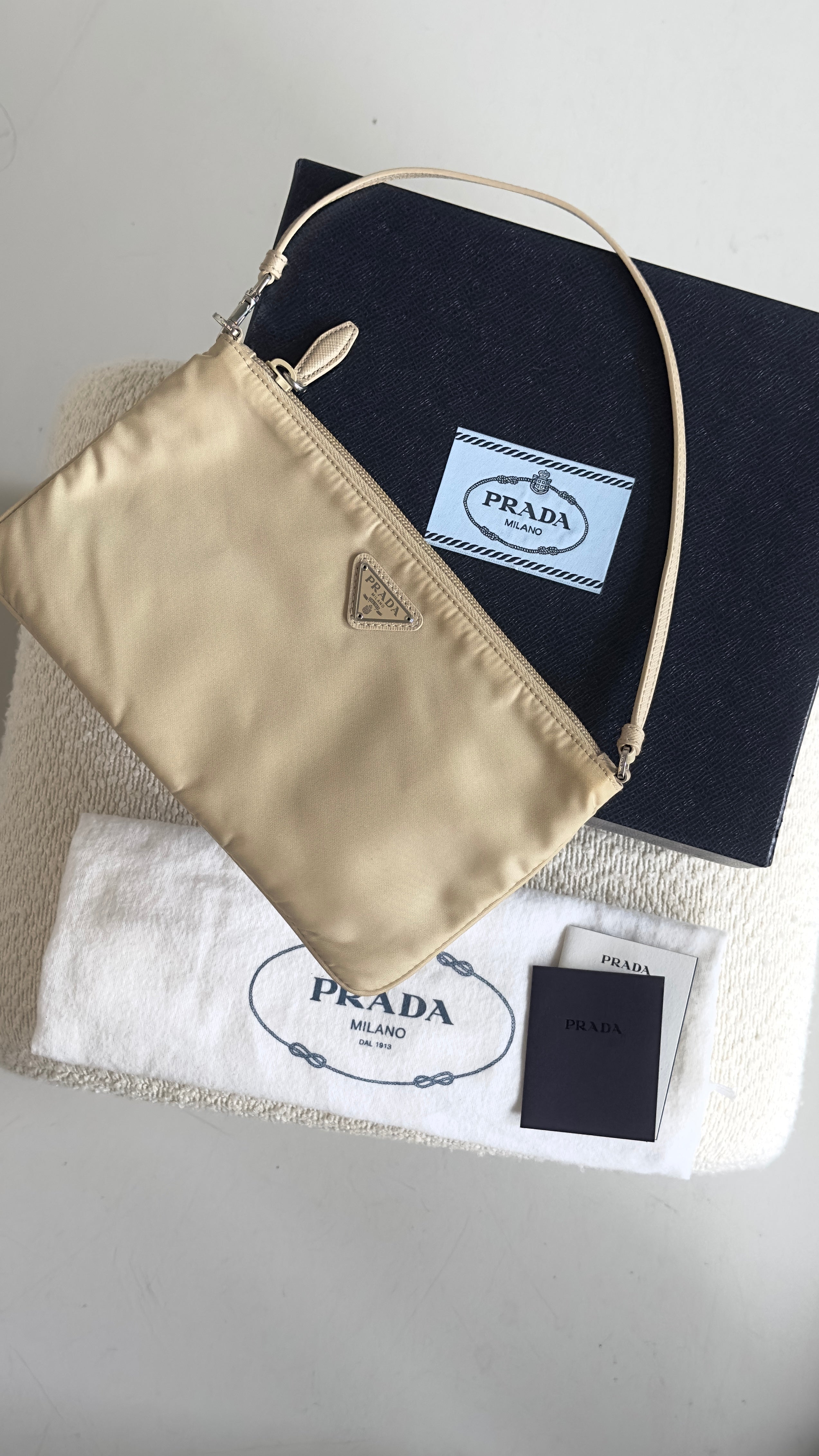 PRADA RE-NYLON TOP HANDLE BAG IN BEIGE