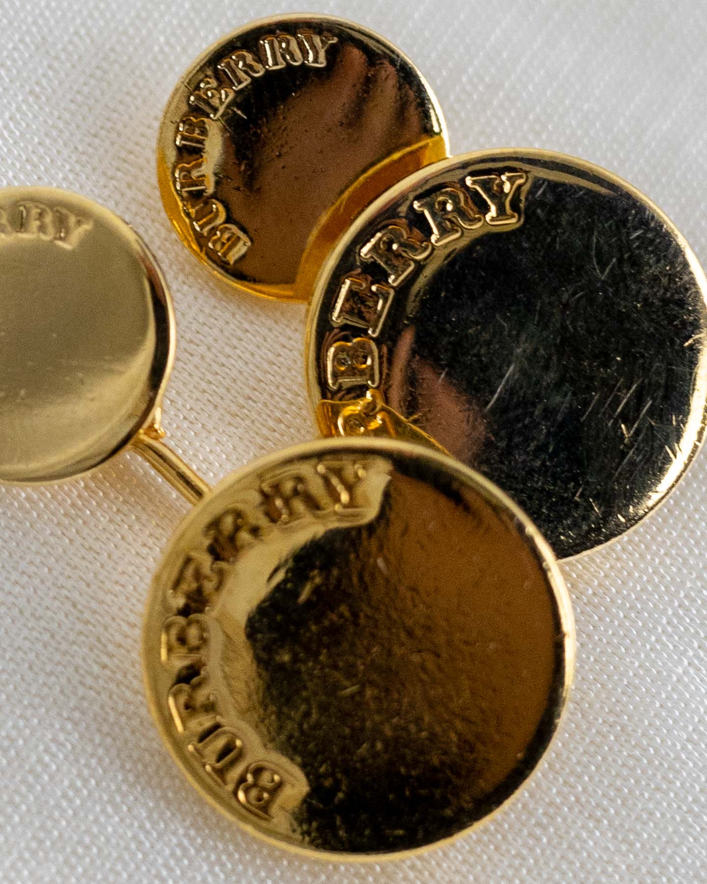 Botões de punho dourados Burberry