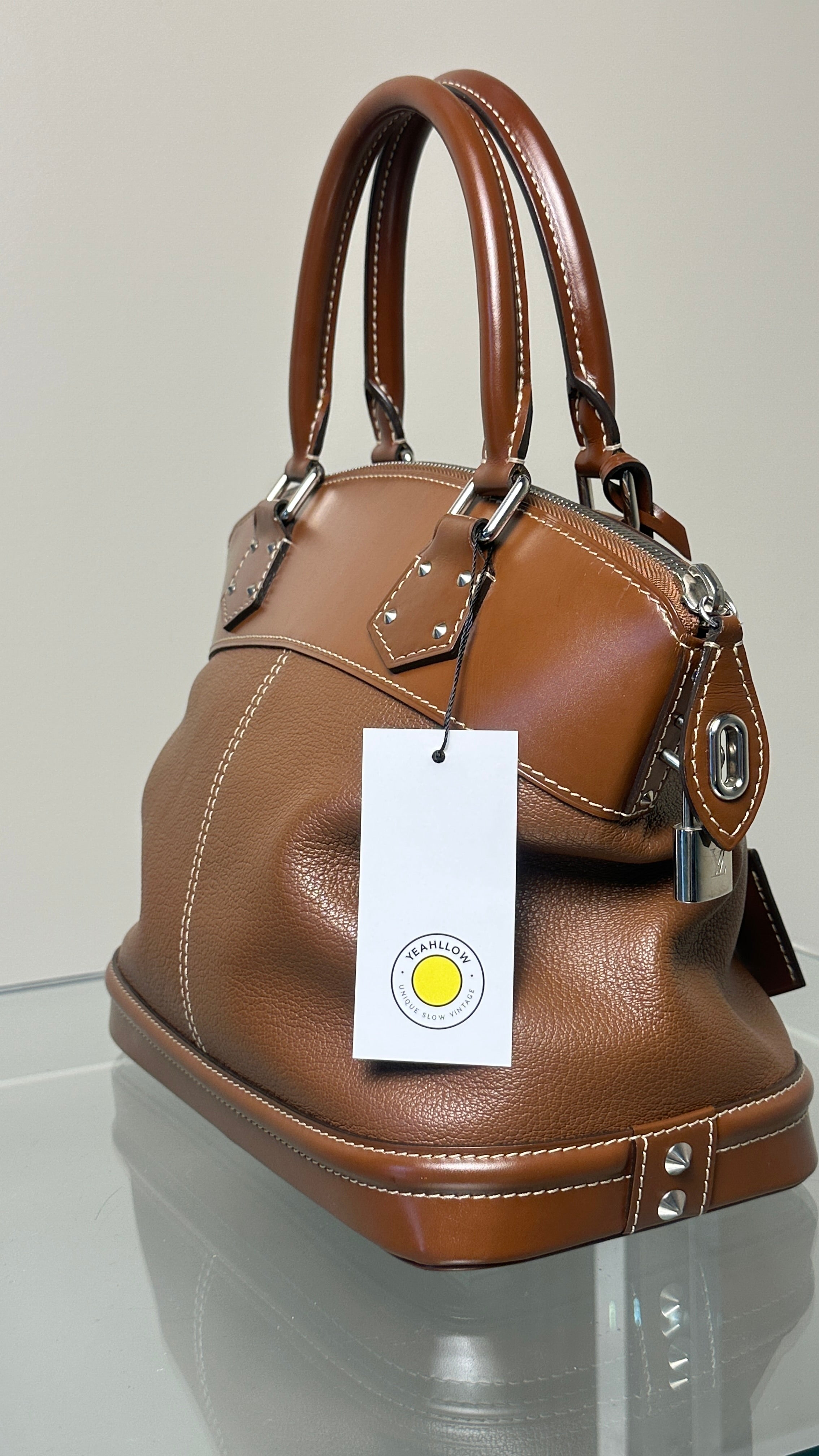 LOUIS VUITTON SIENNE SUHALI LEATHER PM BAG IN BROWN