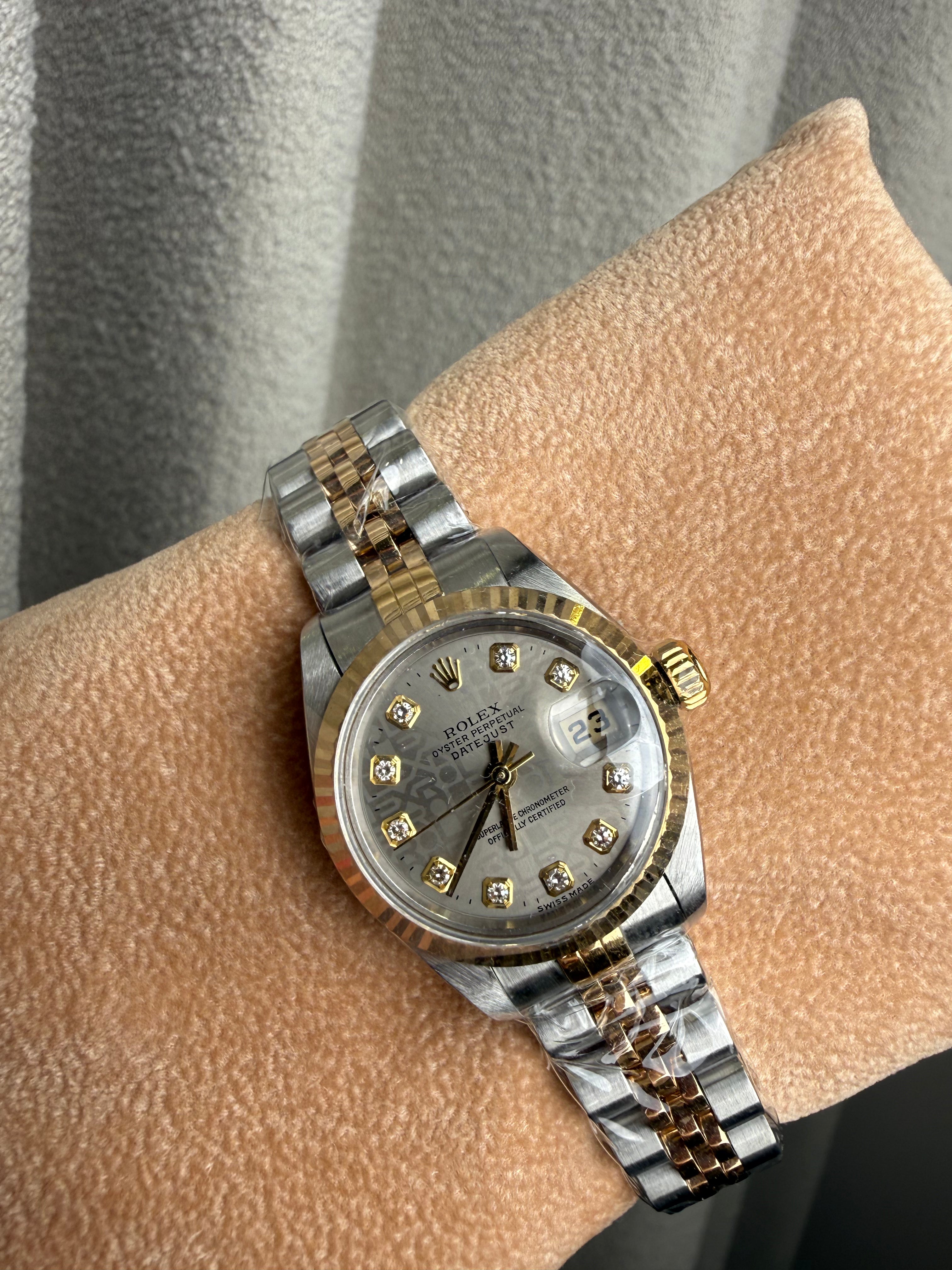 Datejust 26mm in Steel with Yellow Gold Fluted Bezel on Jubilee Bracelet with Silver Jubilee Diamond Dial