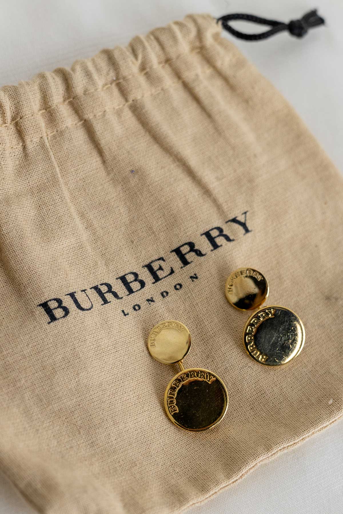 Botões de punho dourados Burberry